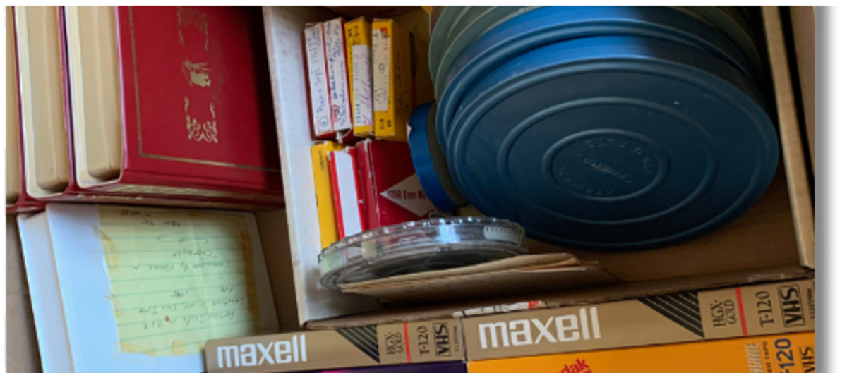 VHS tapes and film reels waiting to be converted