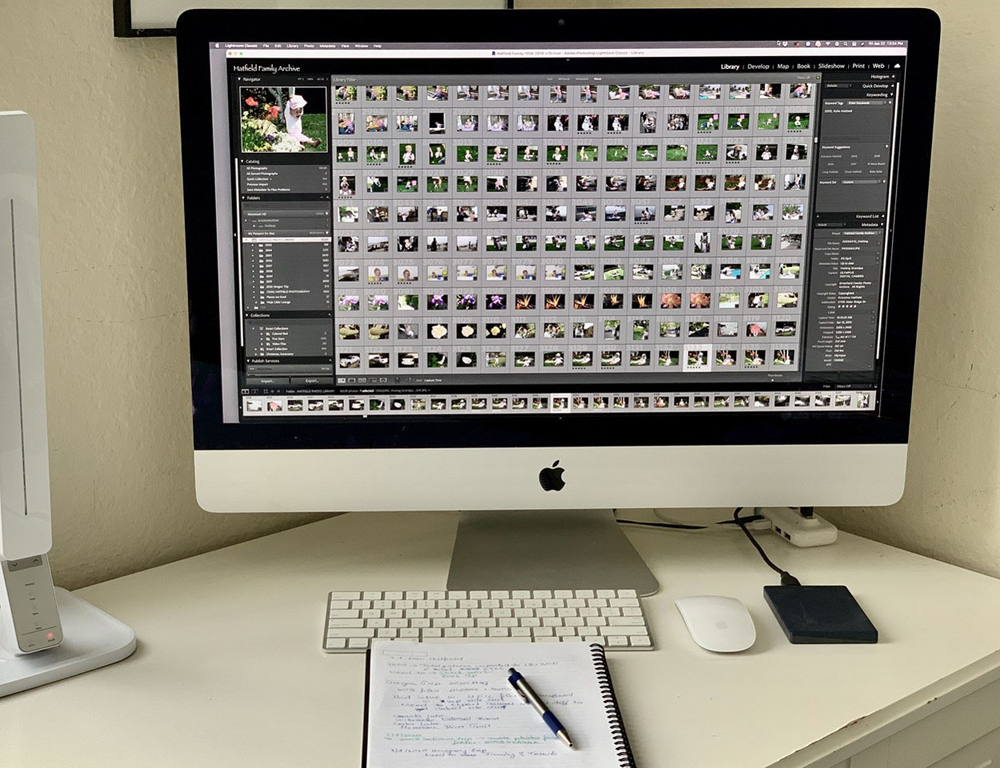 A photo library organized in cataloging software on a desktop computer