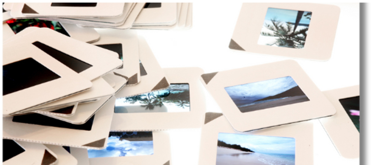 35mm slides spread across a table ready for scanning
